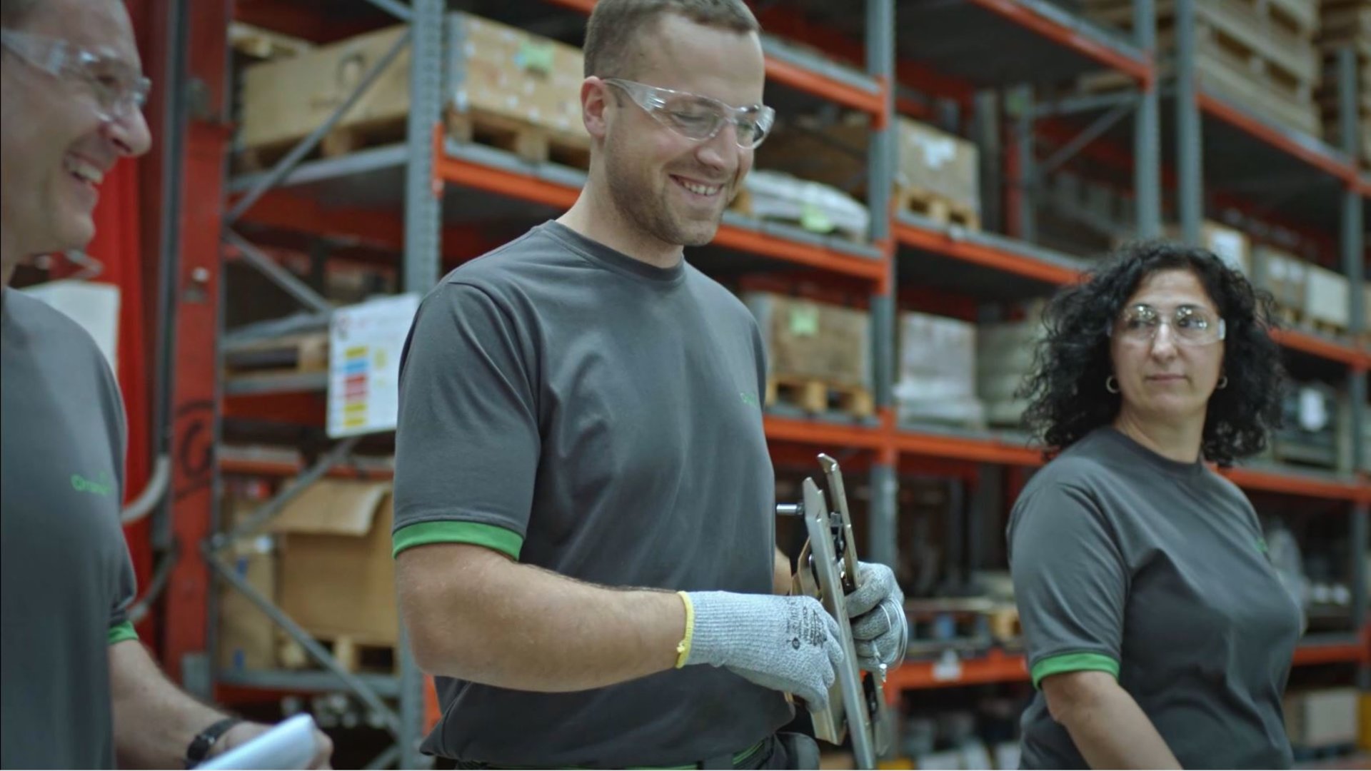 team of Orona workers in factory